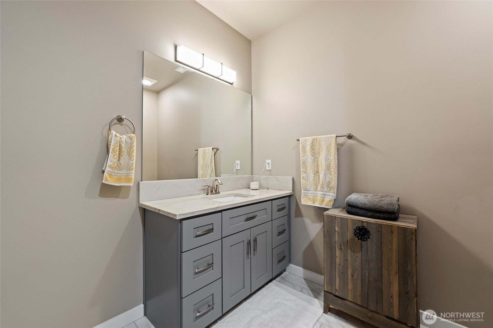 5889 Ne Road Moses Lake, WA 98837 - Photo 14 of 39 a bathroom with a sink a light fixture and a mirror