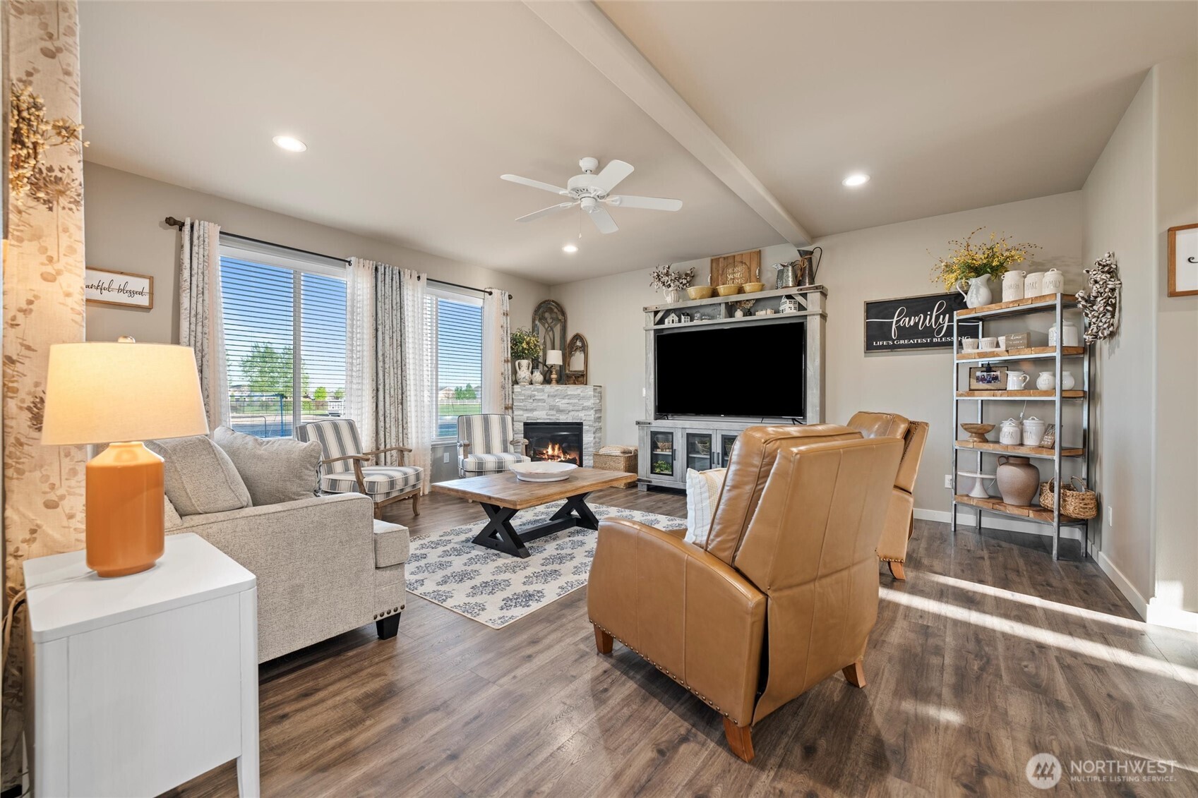 5889 Ne Road Moses Lake, WA 98837 - Photo 18 of 39 a living room with furniture and a flat screen tv