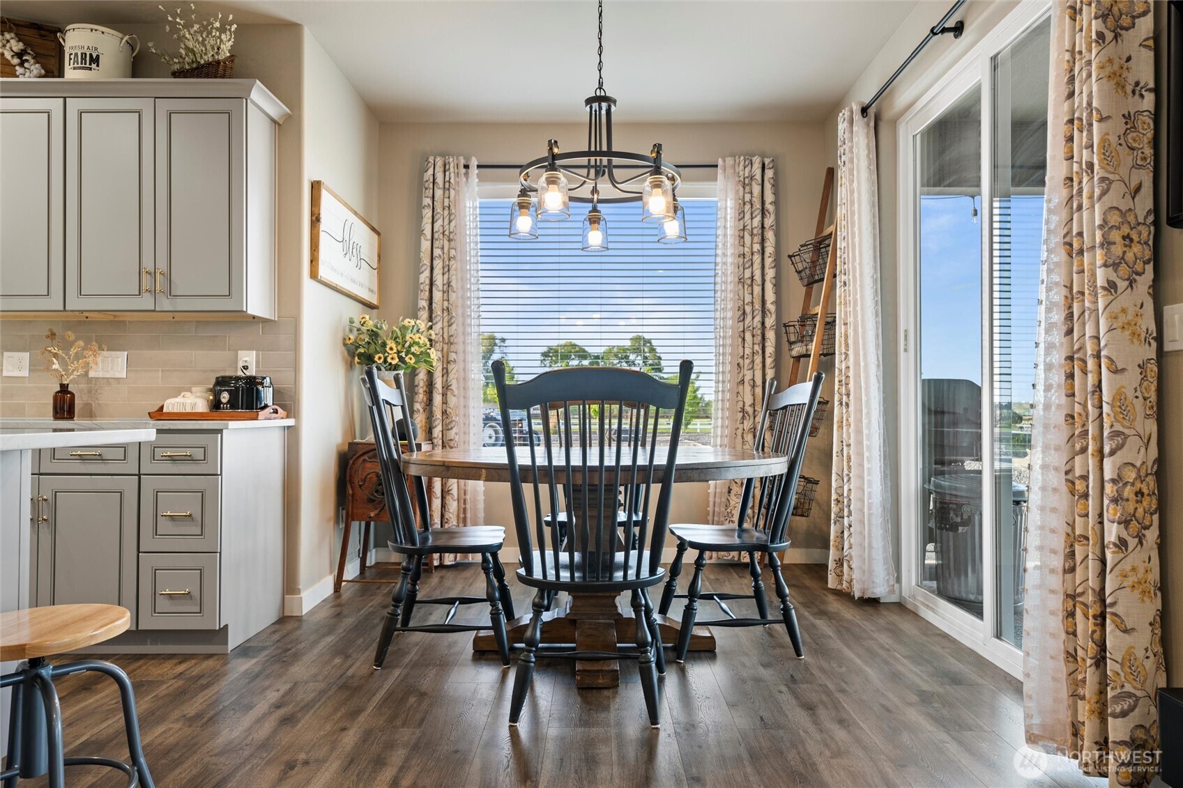 5889 Ne Road Moses Lake, WA 98837 - Photo 20 of 39 a view of a dining room with furniture window and wooden floor