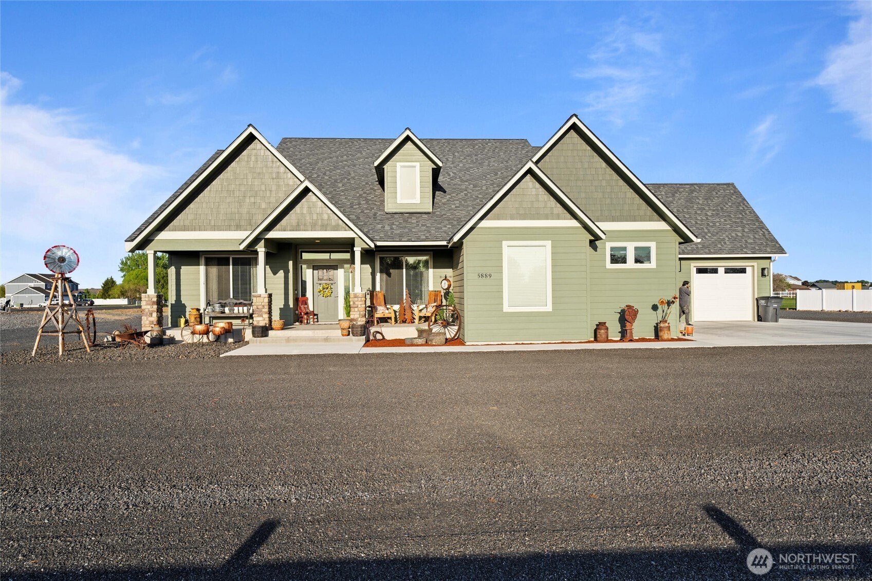 5889 Ne Road Moses Lake, WA 98837 - Photo 2 of 39 a view of a house with a outdoor space and porch