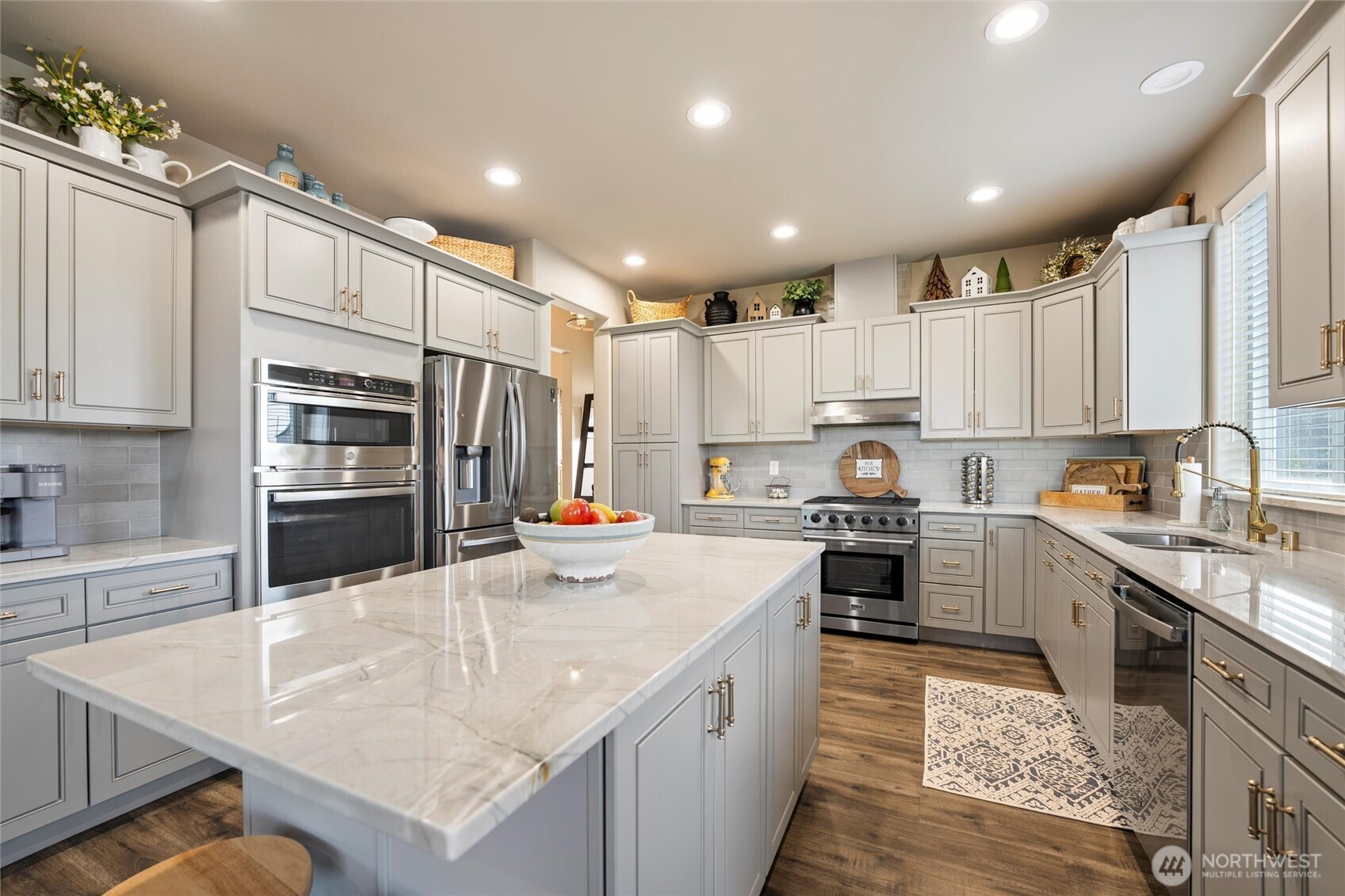 5889 Ne Road Moses Lake, WA 98837 - Photo 22 of 39 a kitchen with kitchen island granite countertop a sink counter top space appliances and cabinets
