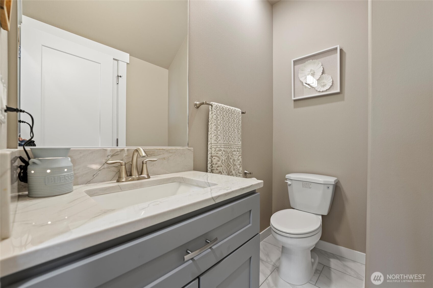 5889 Ne Road Moses Lake, WA 98837 - Photo 23 of 39 a bathroom with a toilet a sink and mirror
