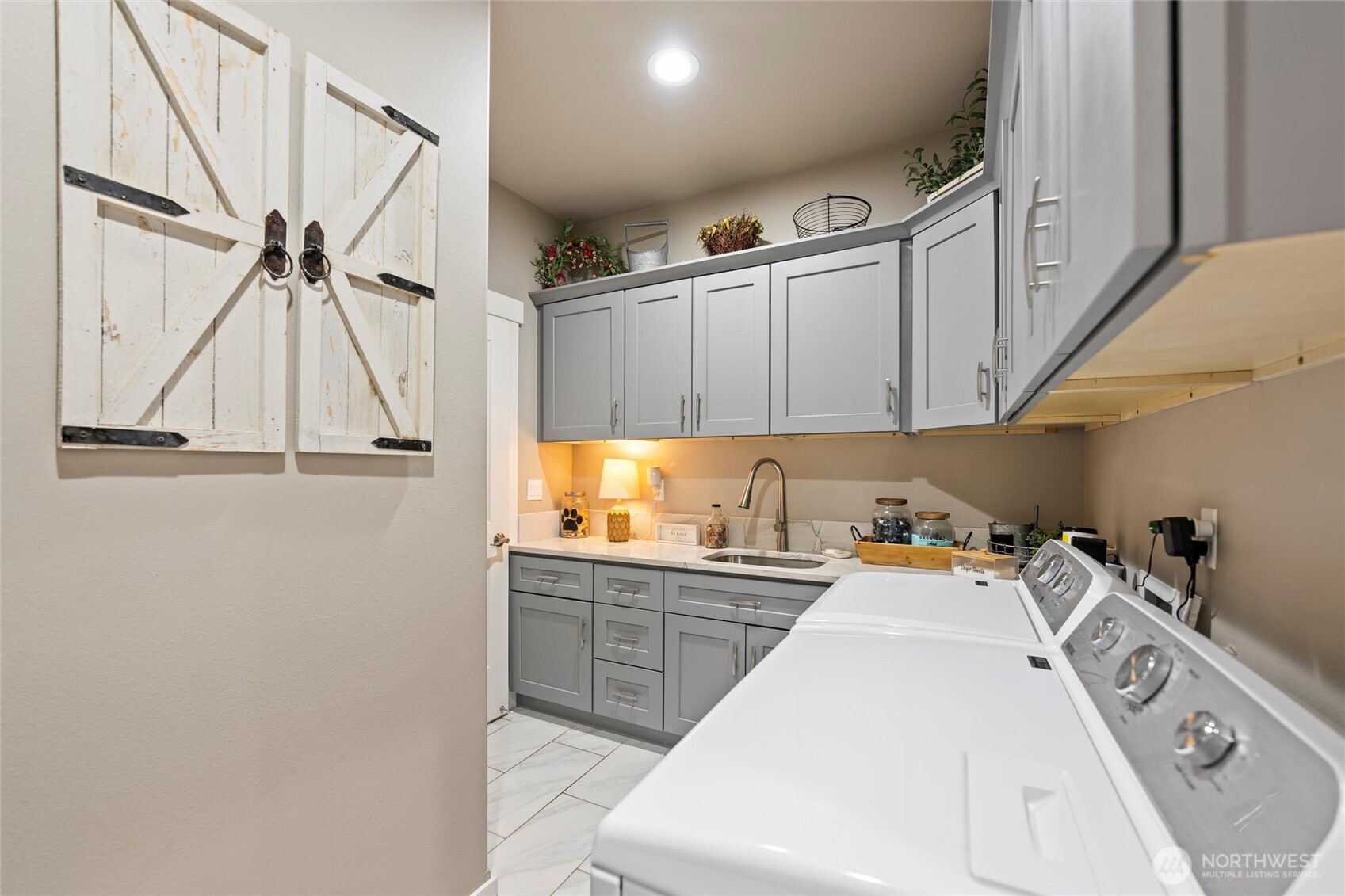 5889 Ne Road Moses Lake, WA 98837 - Photo 29 of 39 a kitchen with white cabinets and white appliances