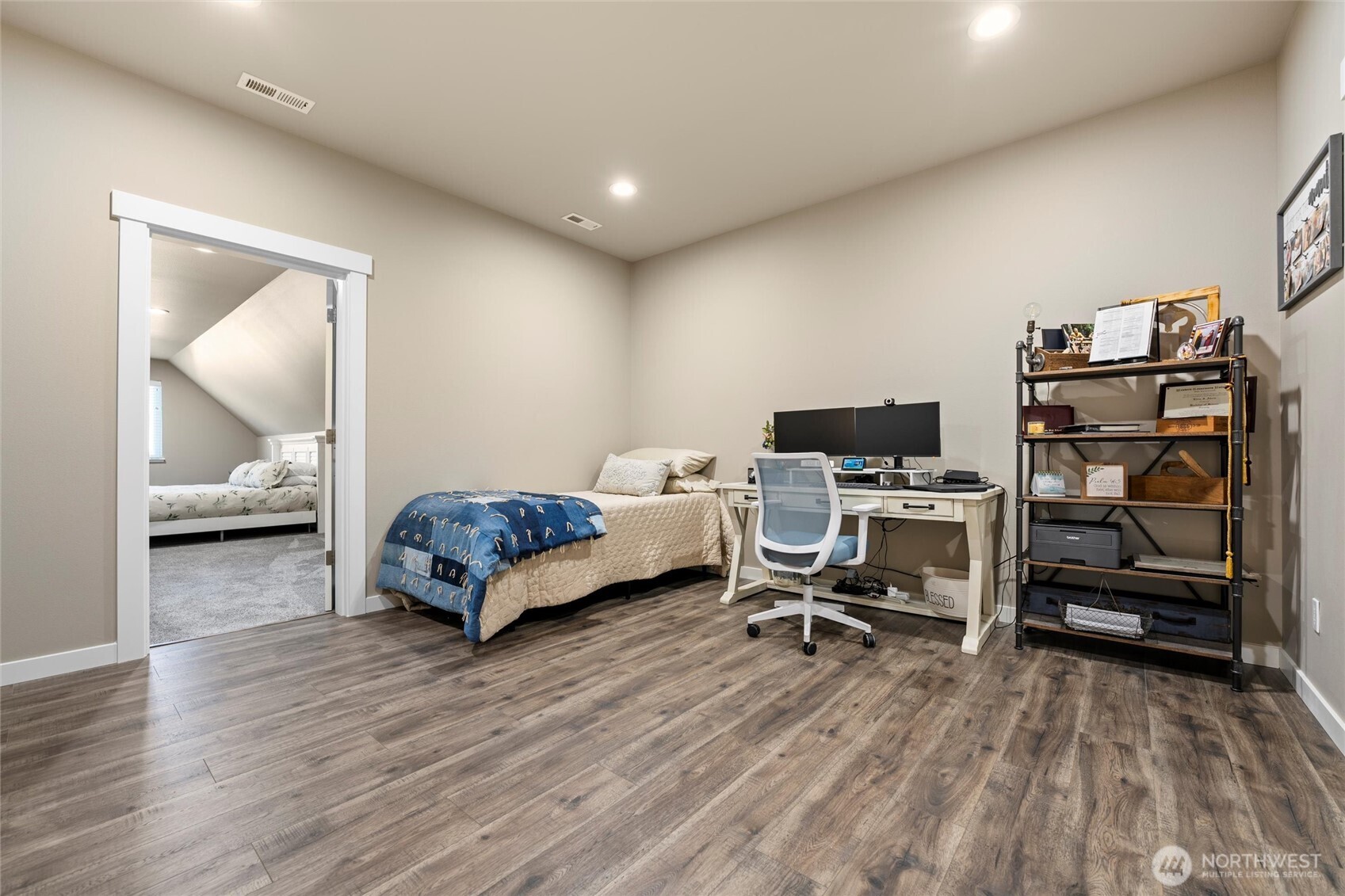 5889 Ne Road Moses Lake, WA 98837 - Photo 31 of 39 a bedroom with furniture and a wooden floor