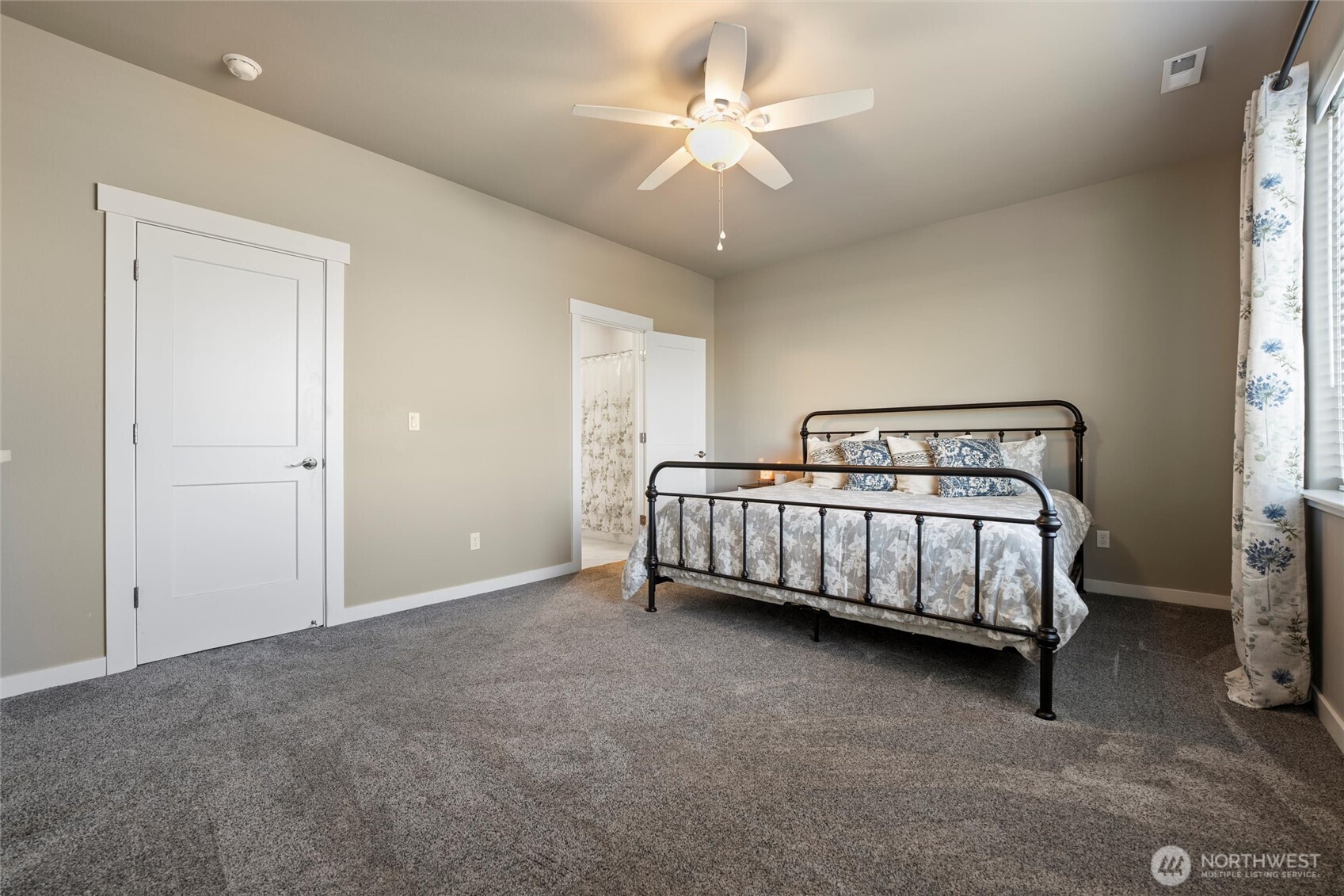 5889 Ne Road Moses Lake, WA 98837 - Photo 34 of 39 a bedroom with a bed and a ceiling fan