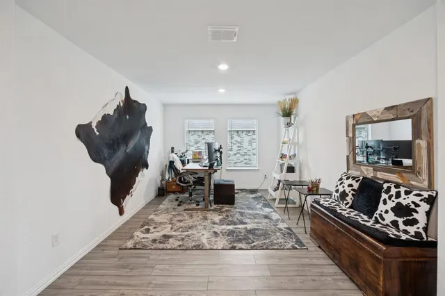 a living room with furniture and a rug