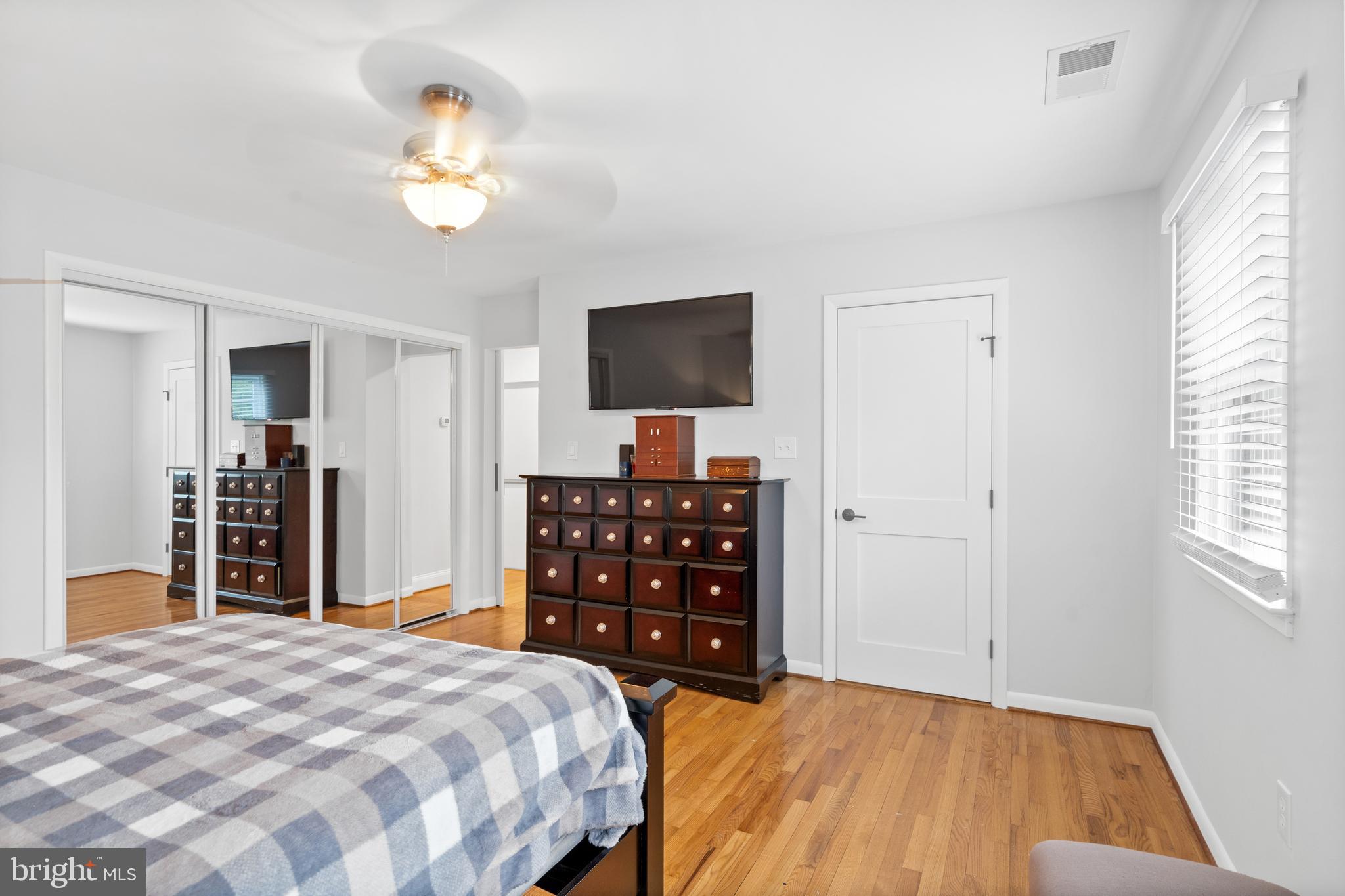 7117 Fort Hunt Road Alexandria, VA 22307 - Photo 23 of 47 Hardwood floors in primary bedroom