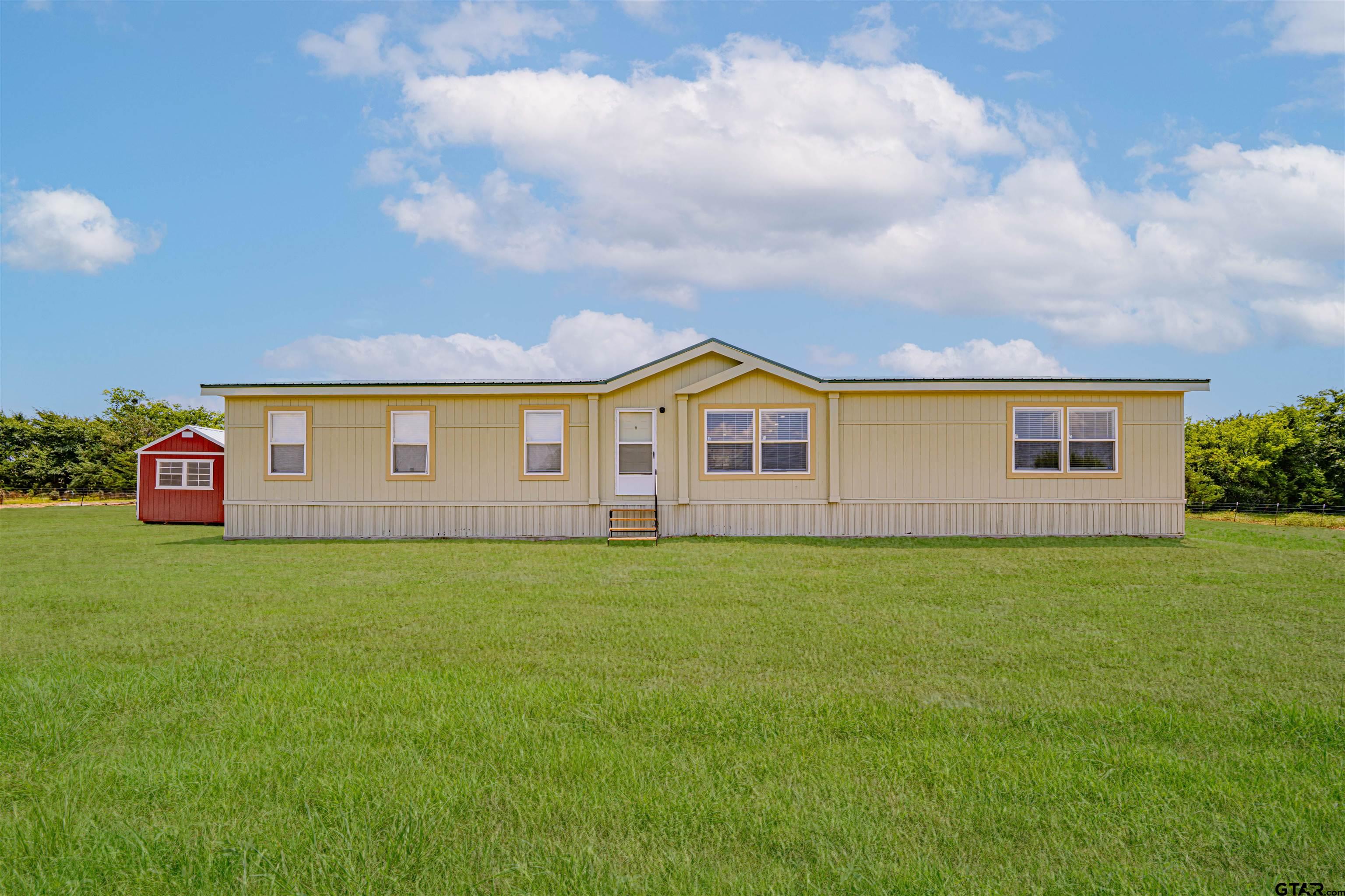95 County Road 3565 Dike, TX 75437 - Photo 11 of 36 a view of a yard in front of a house