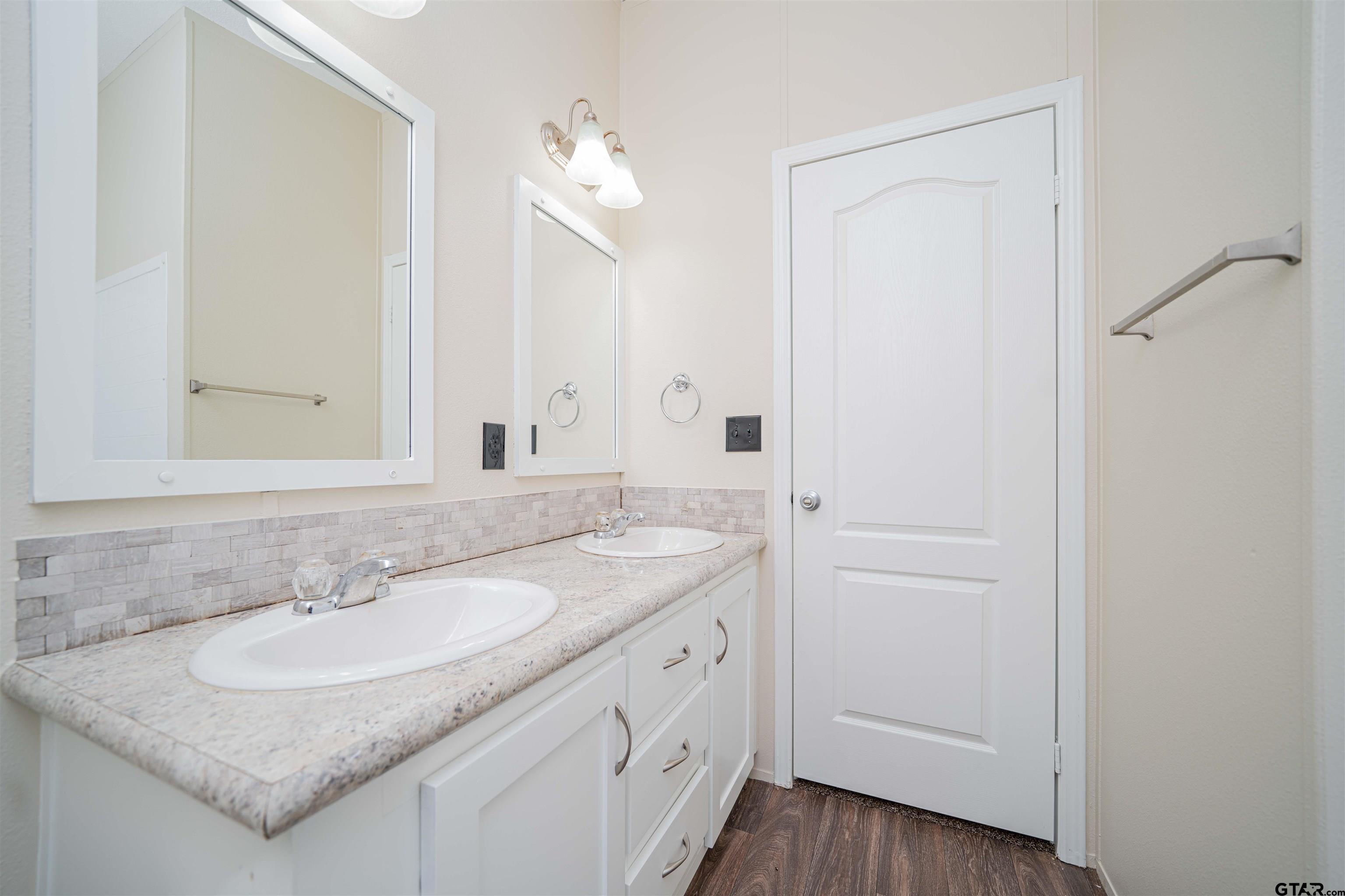 95 County Road 3565 Dike, TX 75437 - Photo 20 of 36 a bathroom with a sink and a mirror