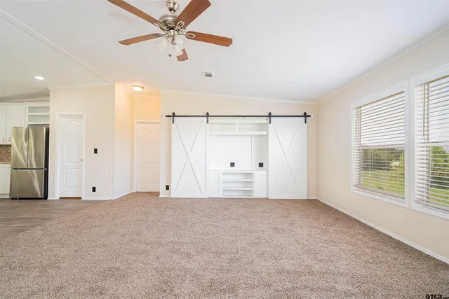a kitchen with stainless steel appliances granite countertop wooden floors sink and cabinets