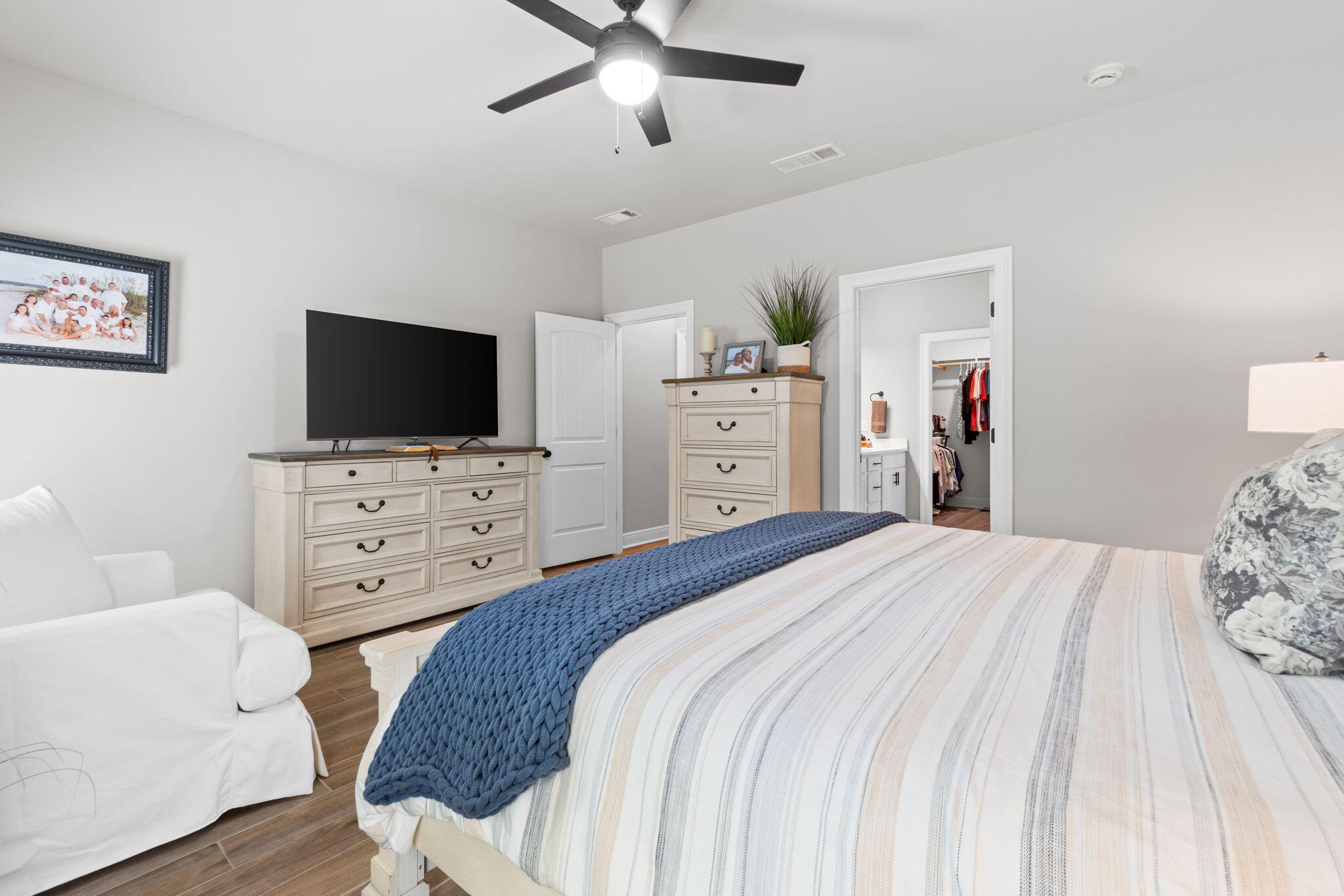 33 Cozy Cove Freeport, FL 32439 - Photo 24 of 87 a bedroom with a bed and a flat screen tv