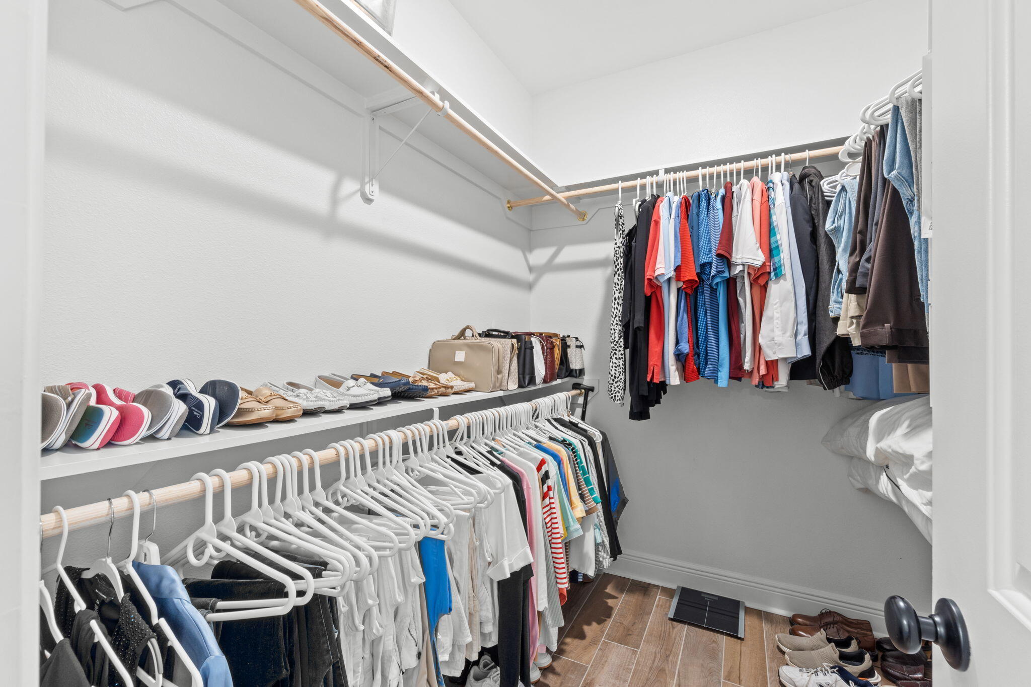 33 Cozy Cove Freeport, FL 32439 - Photo 30 of 87 a view of walk in closet with clothes and shoes