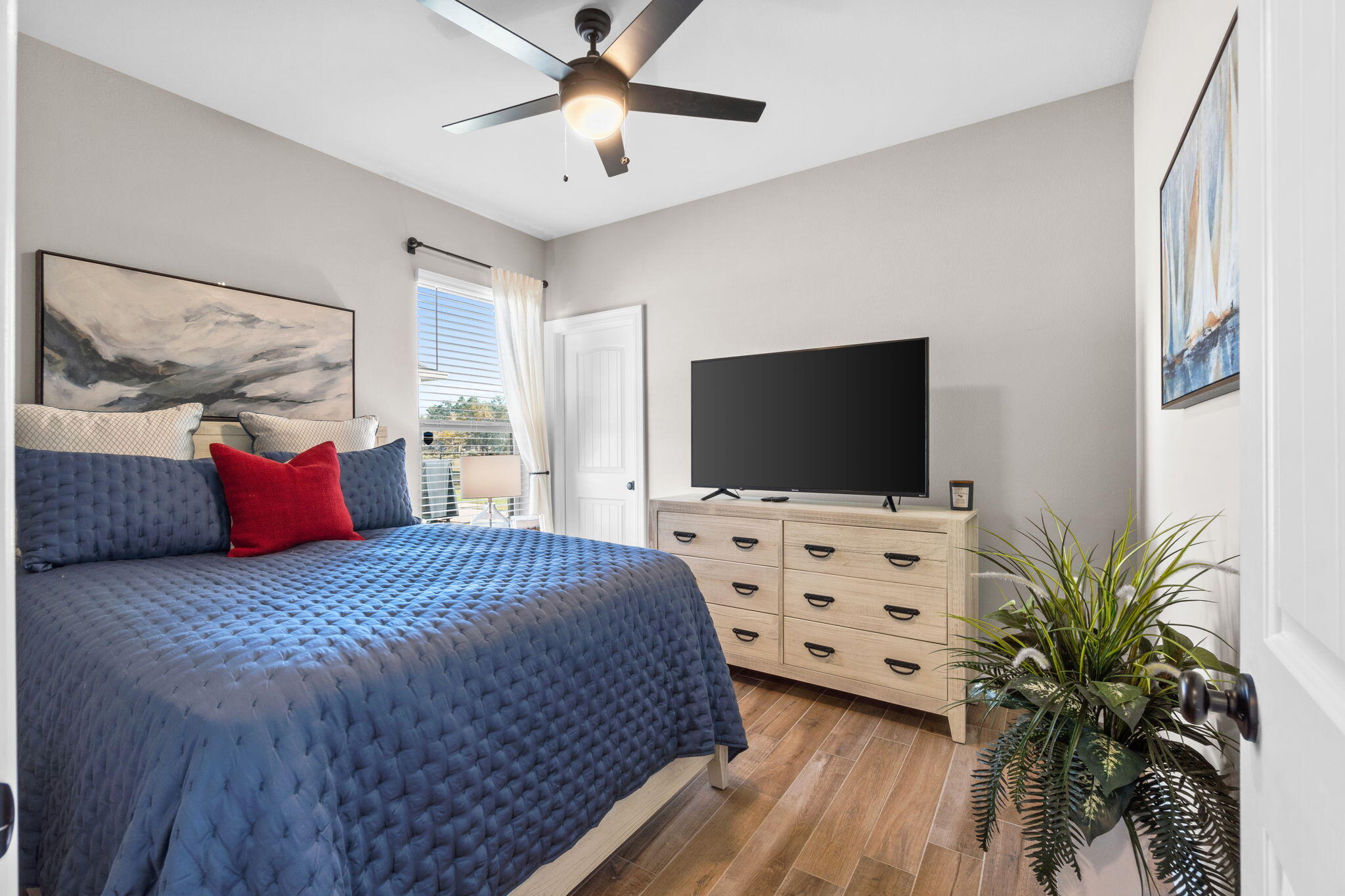 33 Cozy Cove Freeport, FL 32439 - Photo 32 of 87 a bedroom with a bed and a flat screen tv