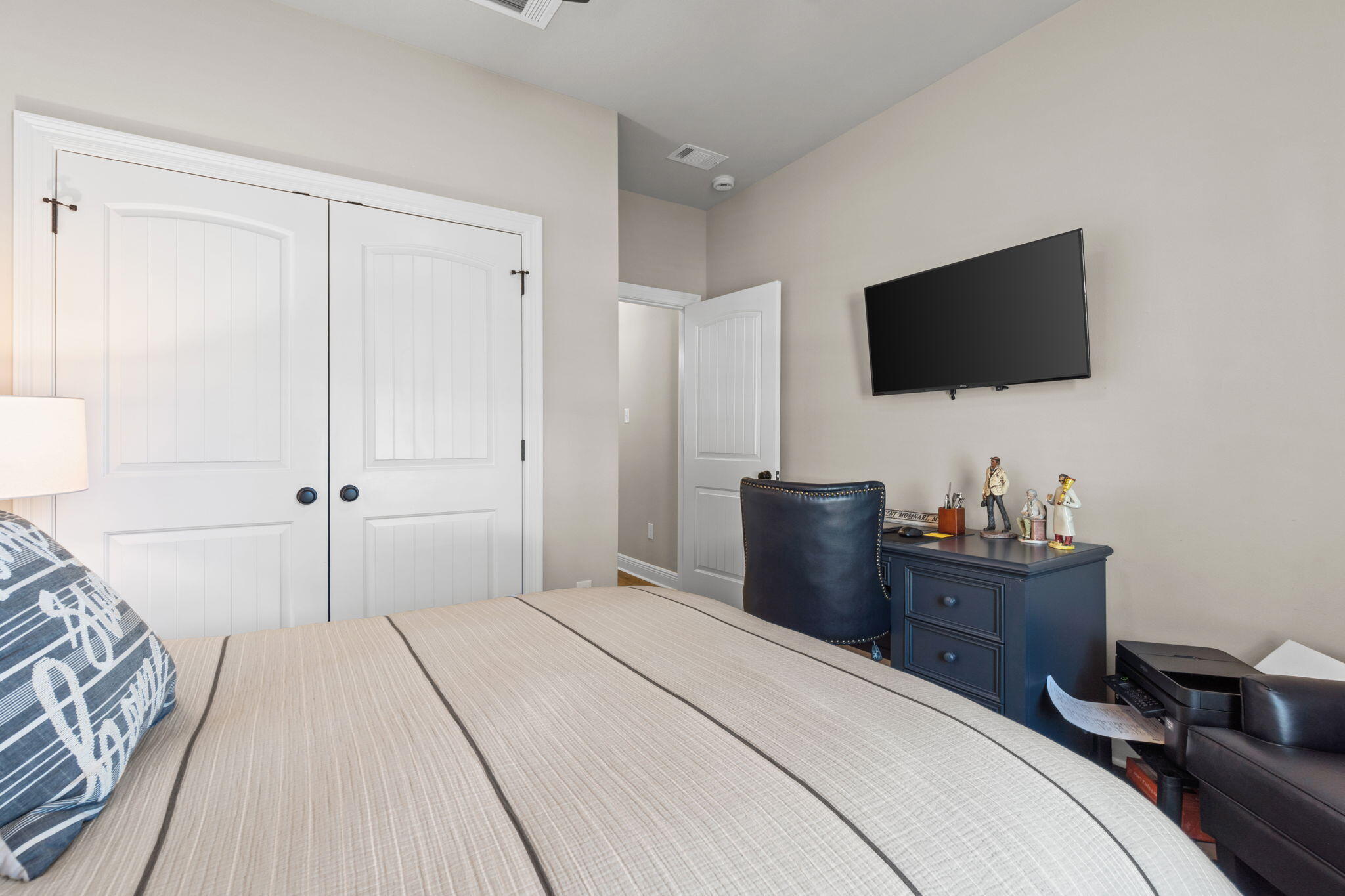 33 Cozy Cove Freeport, FL 32439 - Photo 39 of 87 a bedroom with a bed and a flat screen tv