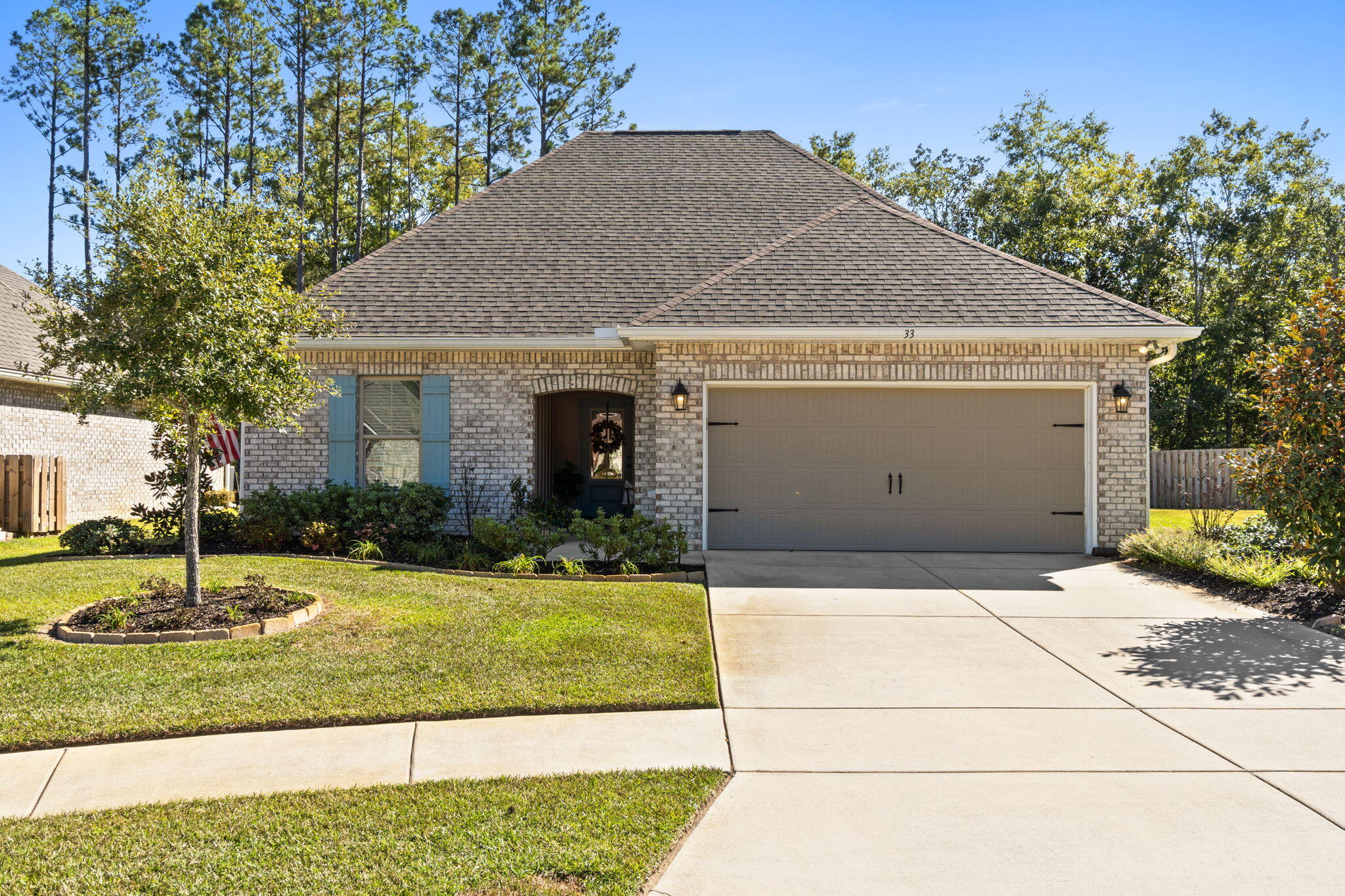 33 Cozy Cove Freeport, FL 32439 - Photo 44 of 87 a front view of a house with garden
