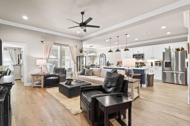 a kitchen with a stove a microwave a dining table and chairs