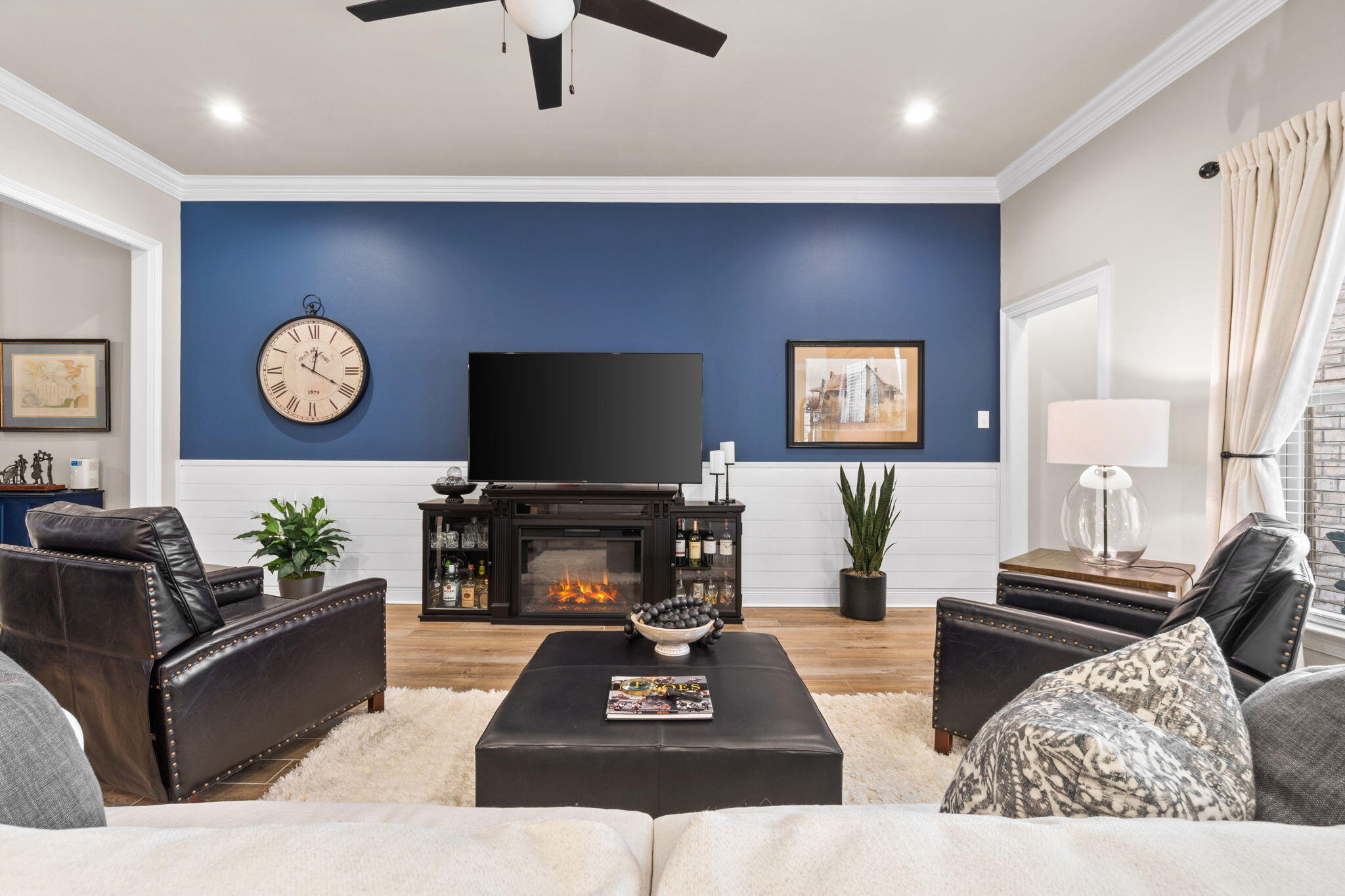 33 Cozy Cove Freeport, FL 32439 - Photo 10 of 87 a living room with furniture a fireplace and a flat screen tv