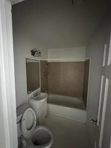 a bathroom with a toilet and a sink
