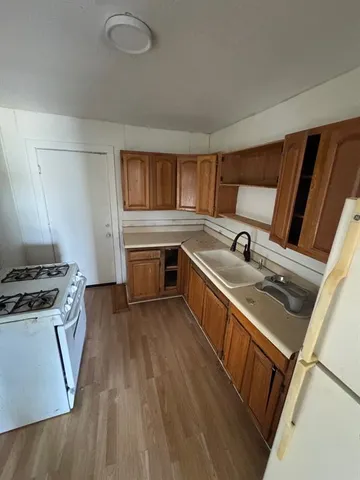 a kitchen that has a sink and a stove
