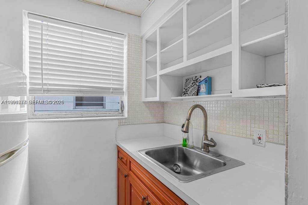 200 76th Street, Unit 59 Miami Beach, FL 33141 - Photo 11 of 16 a close view of sink and tap