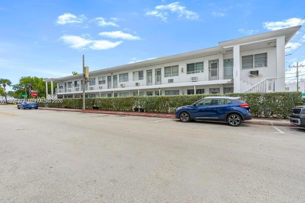 200 76th Street, Unit 59 Miami Beach, FL 33141 - Photo 2 of 16 a car parked in front of a building