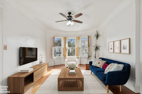 a living room with furniture fireplace and flat screen tv