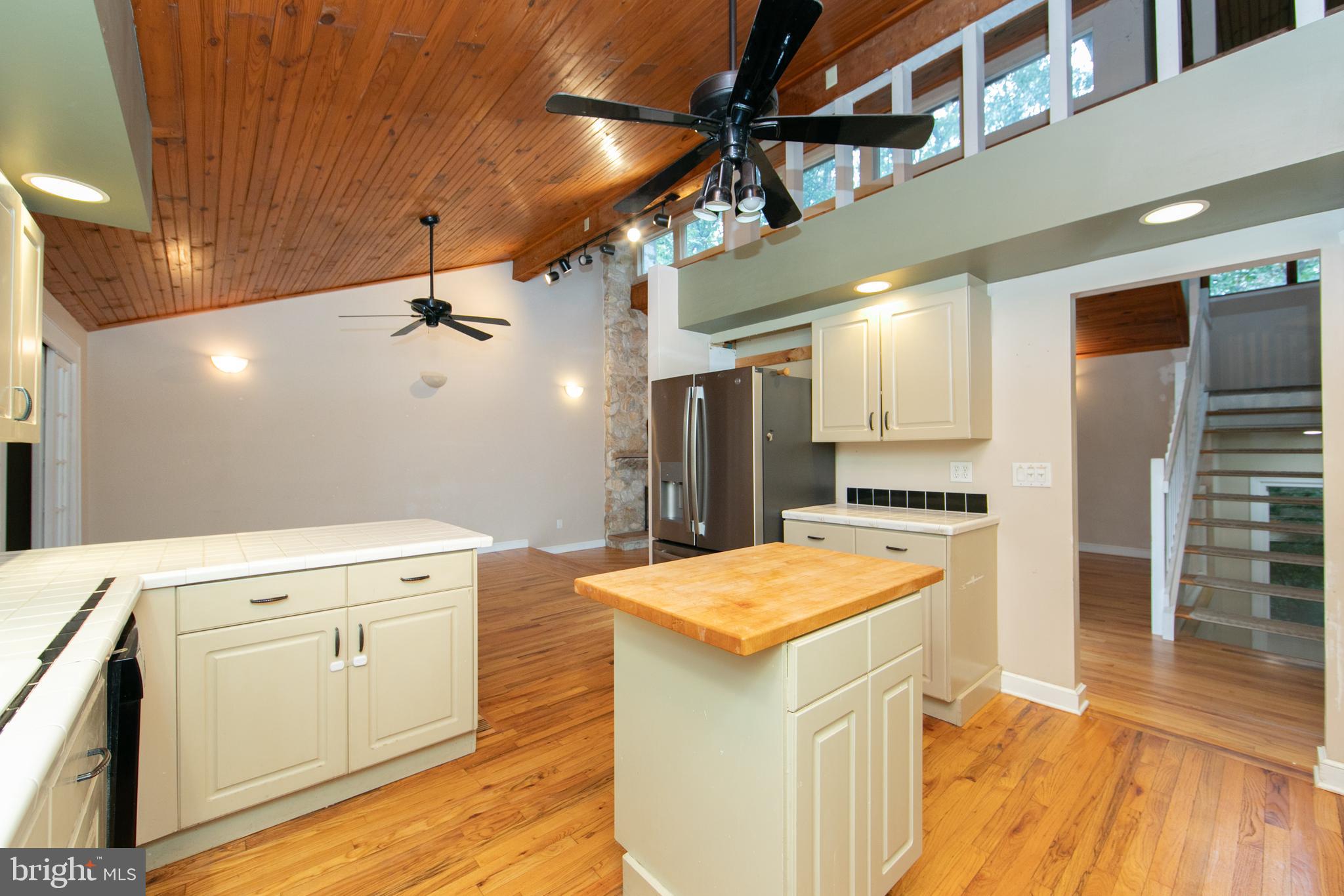 18 Tomahawk Court Medford, NJ 08055 - Photo 21 of 68 a kitchen with a stove a refrigerator and a microwave oven