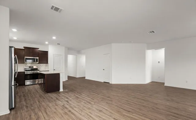 a view of kitchen with wooden floor