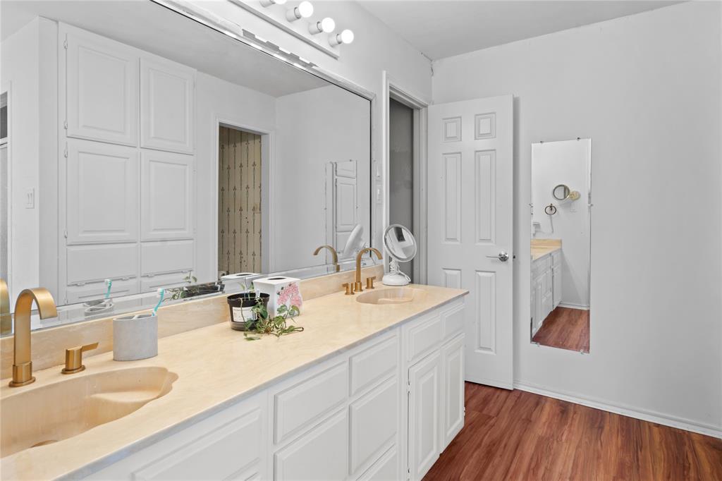 3506 Ruidoso Drive Arlington, TX 76017 - Photo 26 of 37 Dual vanity featuring integrated sinks and brass-finish fixtures