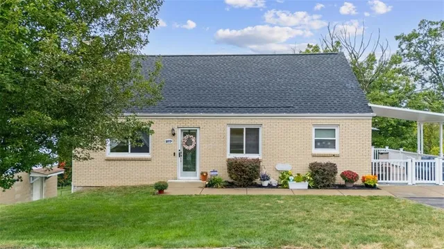 a front view of a house with a yard