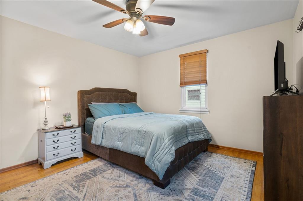 217 McMichael Road Carnegie, PA 15106 - Photo 15 of 38 a bedroom with a bed and a chandelier