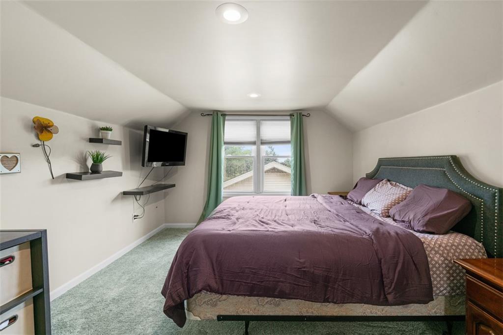 217 McMichael Road Carnegie, PA 15106 - Photo 23 of 38 a bedroom with a bed and flat tv screen on the dresser