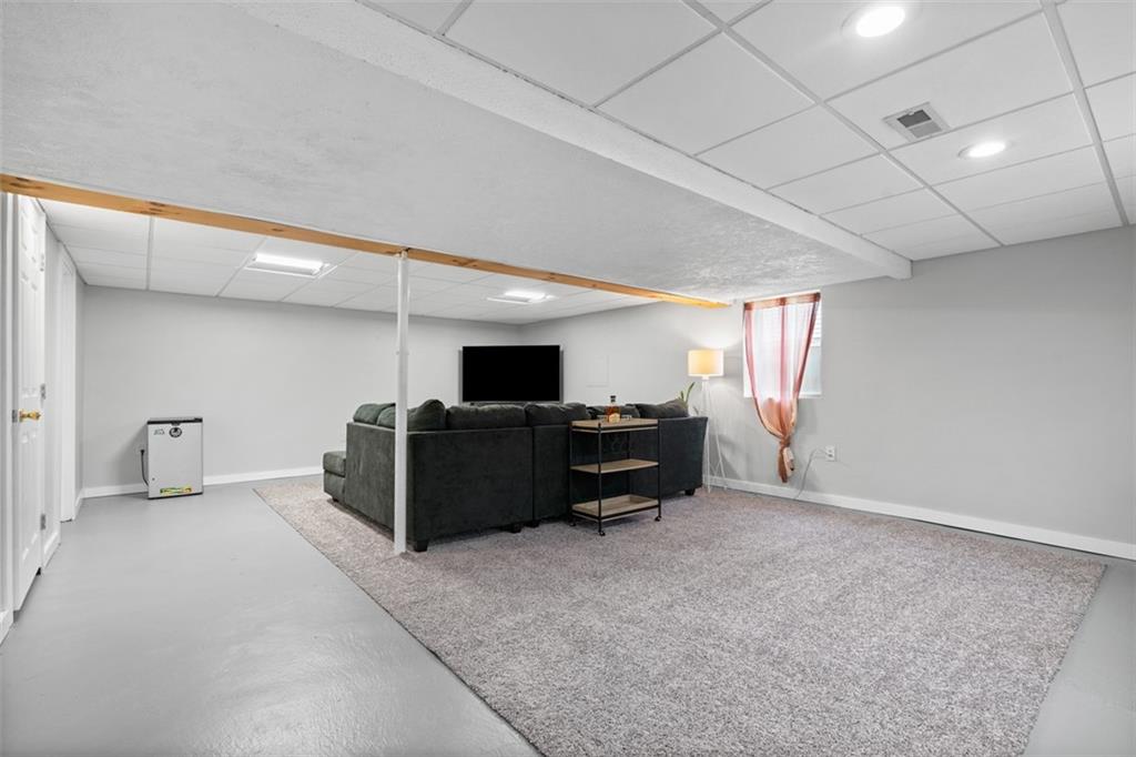 217 McMichael Road Carnegie, PA 15106 - Photo 25 of 38 a living room with furniture and a flat screen tv