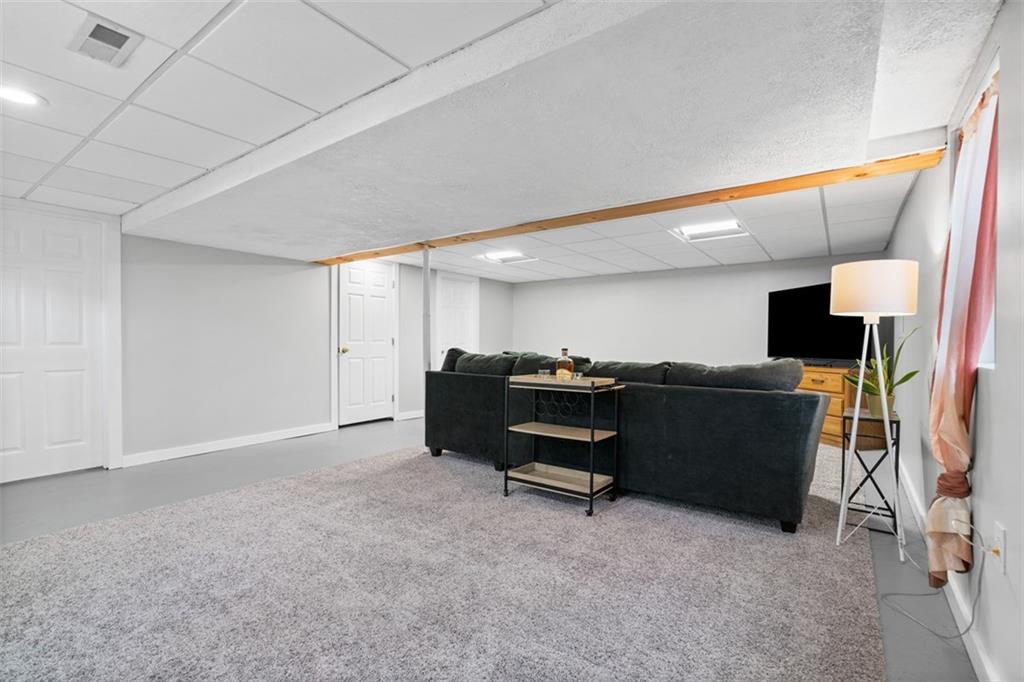 217 McMichael Road Carnegie, PA 15106 - Photo 26 of 38 a living room with furniture and a flat screen tv