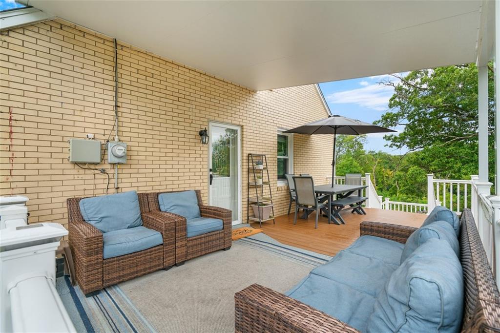 217 McMichael Road Carnegie, PA 15106 - Photo 31 of 38 a outdoor space with patio the couches and a dining table with garden view