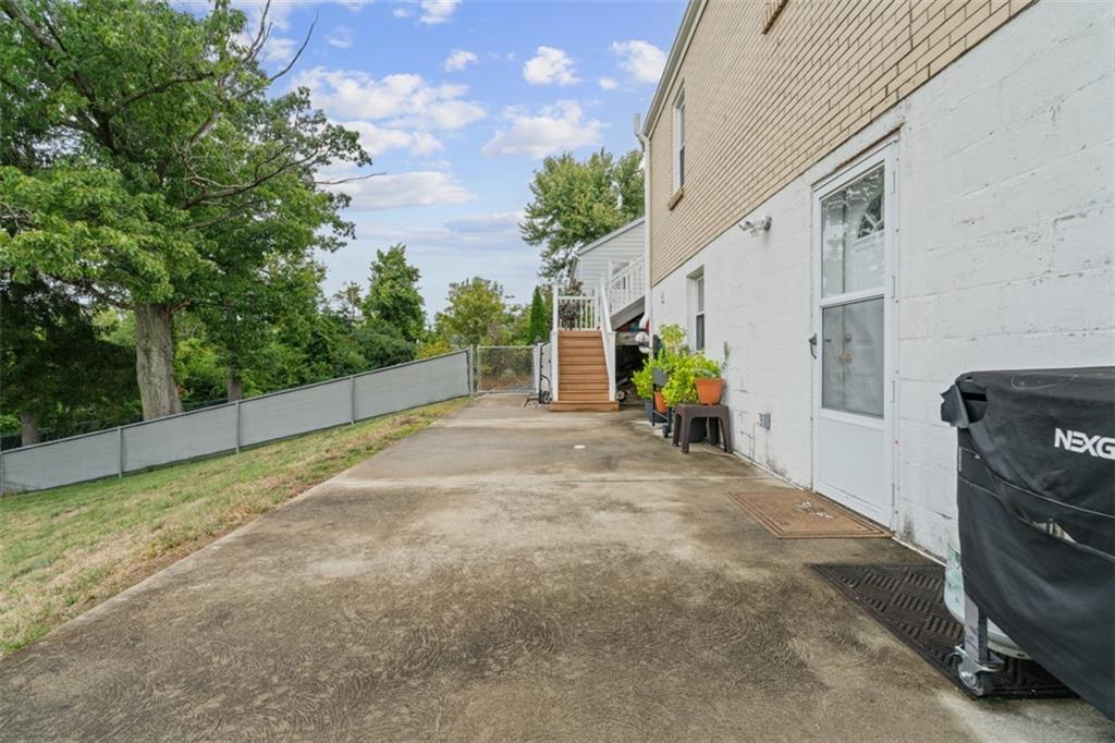 217 McMichael Road Carnegie, PA 15106 - Photo 37 of 38 a view of a house with backyard and a tree