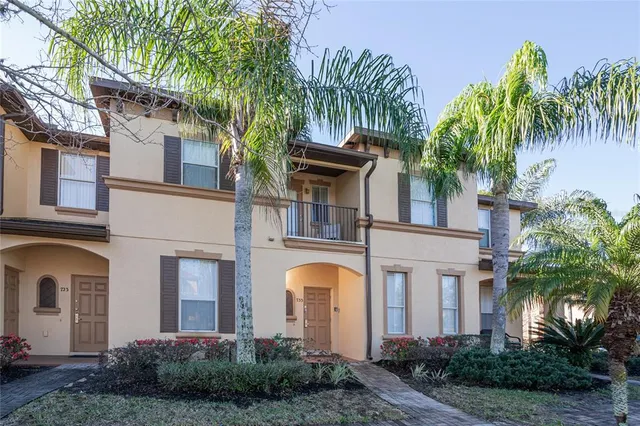 a front view of a house with lots of green space