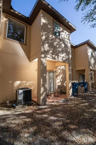 an aerial view of residential house with outdoor space and swimming pool