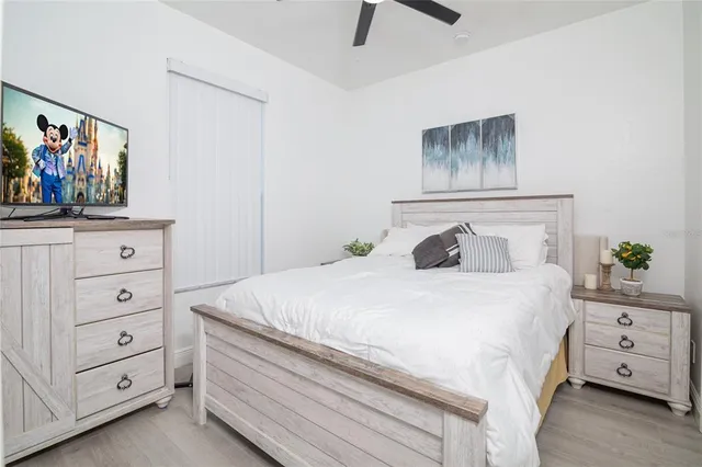 a bedroom with a bed and a dresser