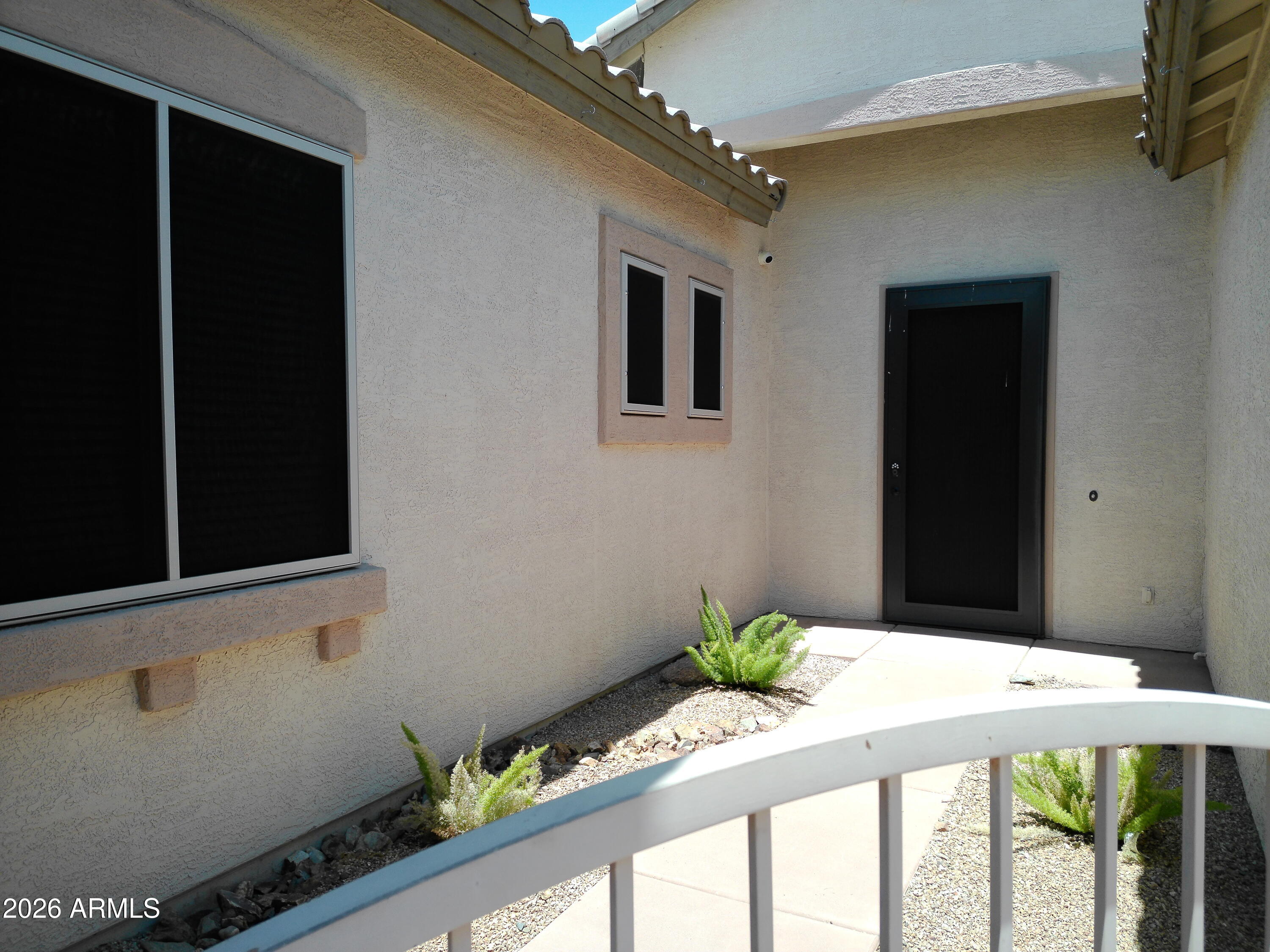 3018 West Sentinel Rock Road Phoenix, AZ 85086 - Photo 3 of 16 a front view of house with an outdoor space