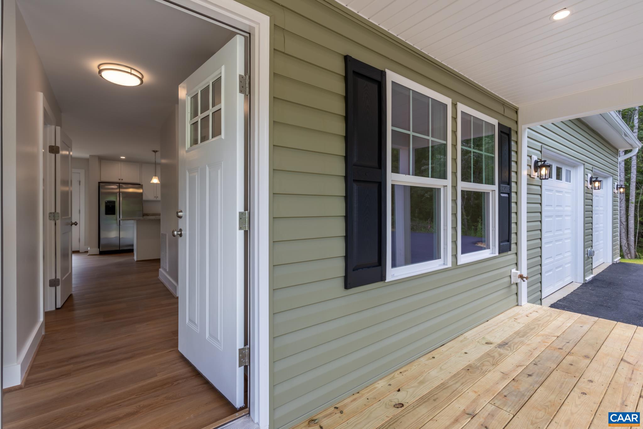 242 Palmer Place Ruckersville, VA 22968 - Photo 10 of 69 a view of a house with wooden floor