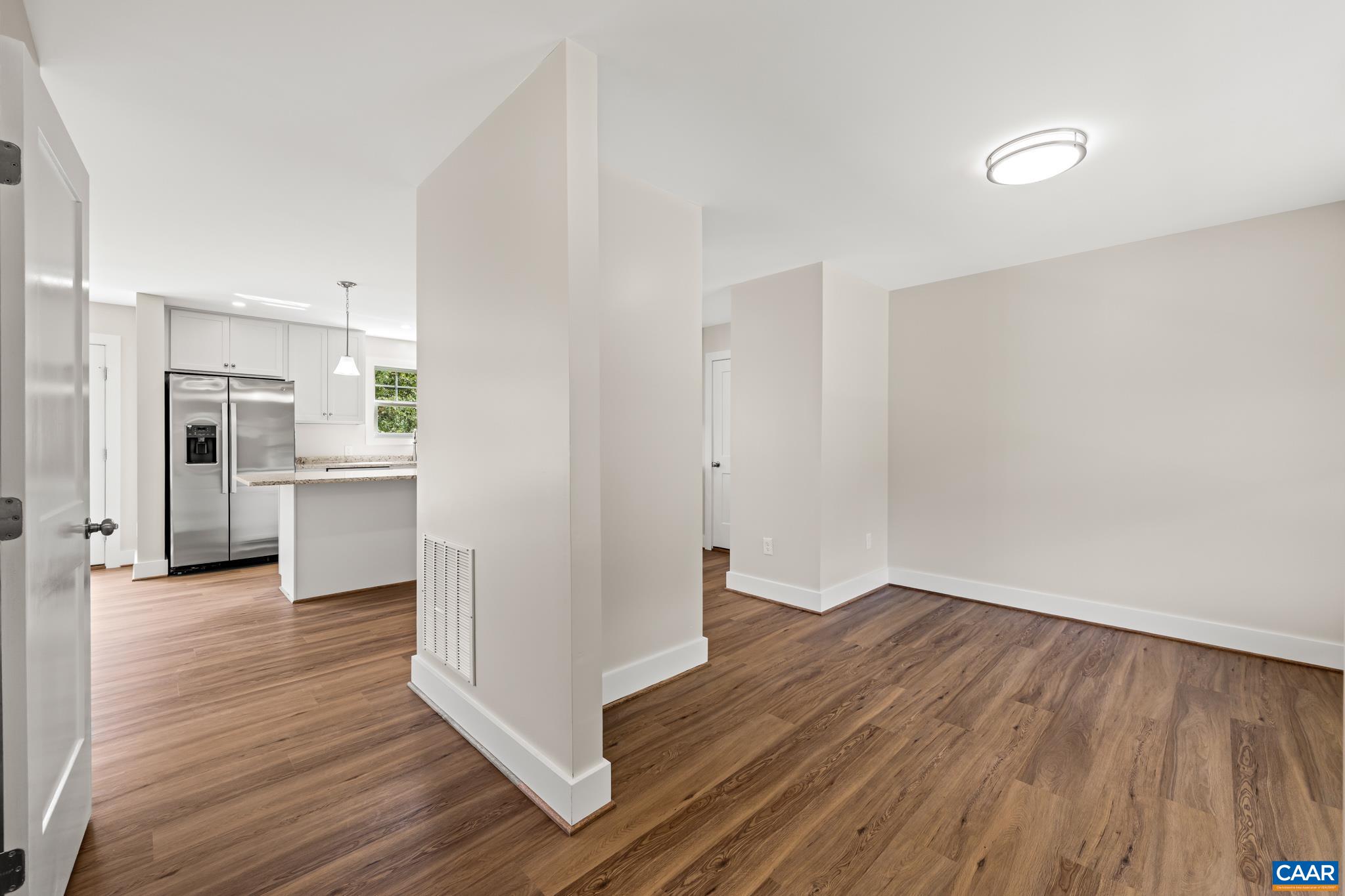 242 Palmer Place Ruckersville, VA 22968 - Photo 11 of 69 a view of a kitchen with wooden floor and a sink