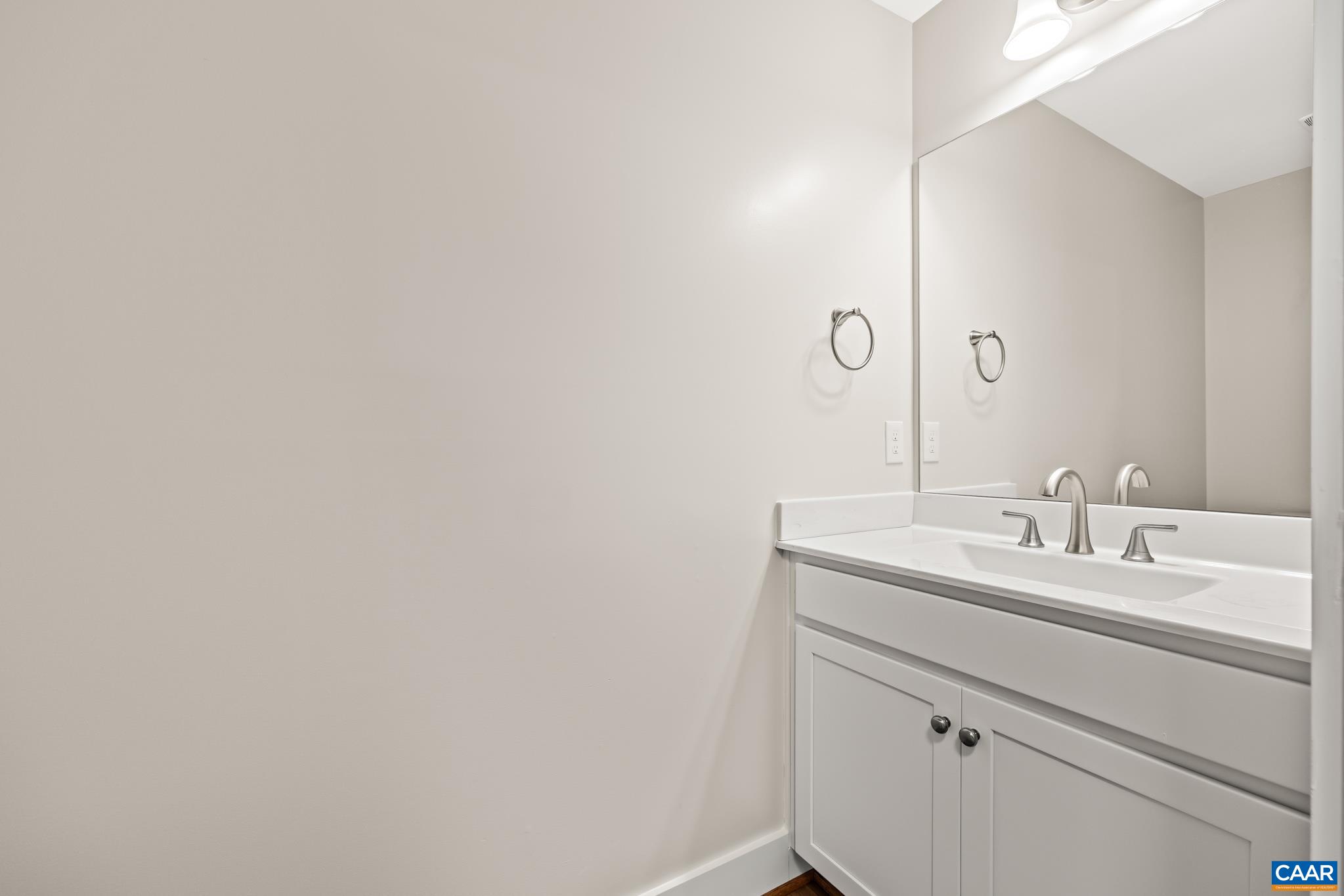 242 Palmer Place Ruckersville, VA 22968 - Photo 22 of 69 a bathroom with a sink and a mirror