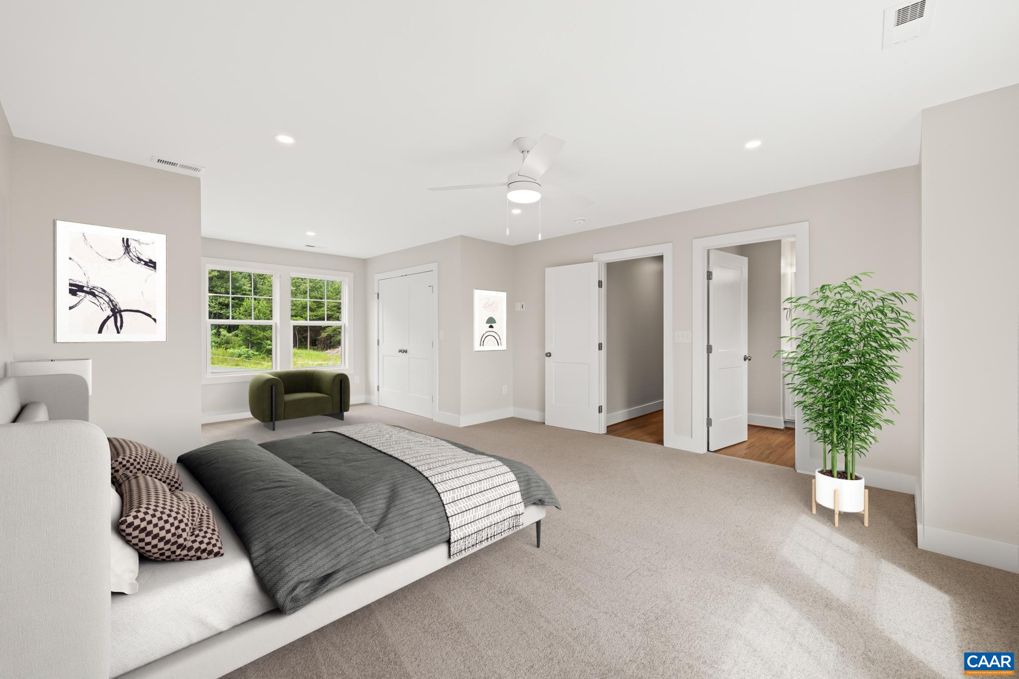 242 Palmer Place Ruckersville, VA 22968 - Photo 35 of 69 a spacious bedroom with a large bed and a potted plant