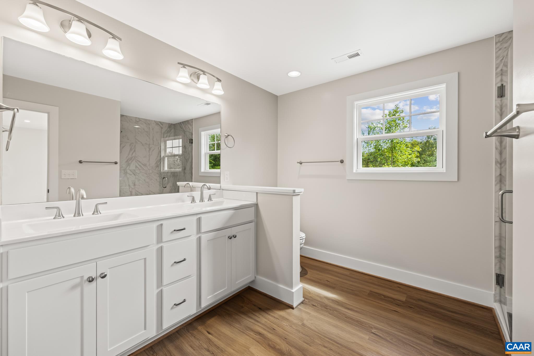 242 Palmer Place Ruckersville, VA 22968 - Photo 36 of 69 a spacious bathroom with a double vanity sink and a window