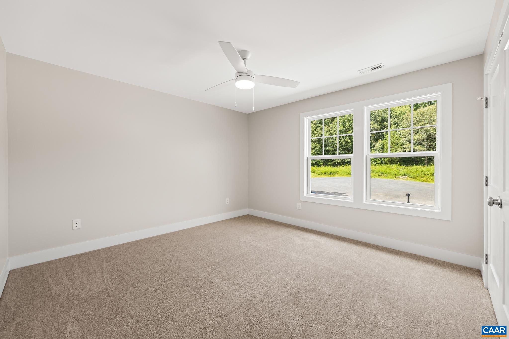 242 Palmer Place Ruckersville, VA 22968 - Photo 41 of 69 an empty room with a window and a ceiling fan