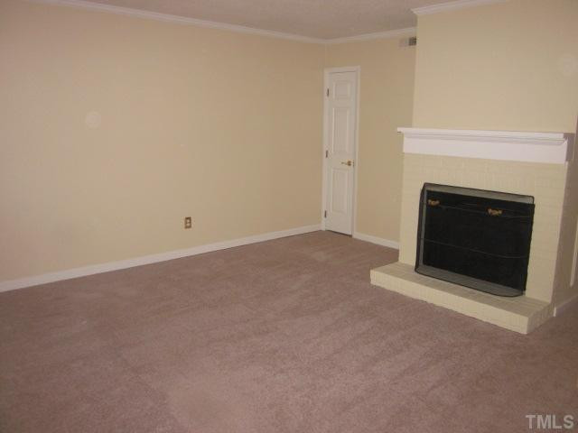 701 Charleston Road Raleigh, NC 27606 - Photo 11 of 25 Curl up with your favorite book on a winter's evening in front of this fireplace! Nice and cozy living room! Living Room