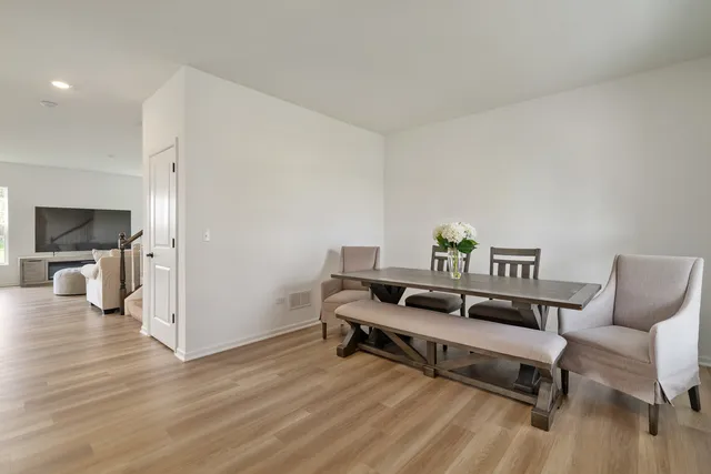 a view of a livingroom with furniture and wooden floor