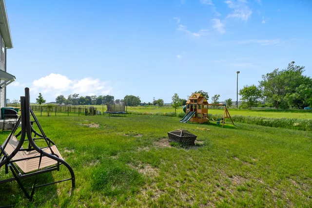 a childrens park with lots of swings and slides
