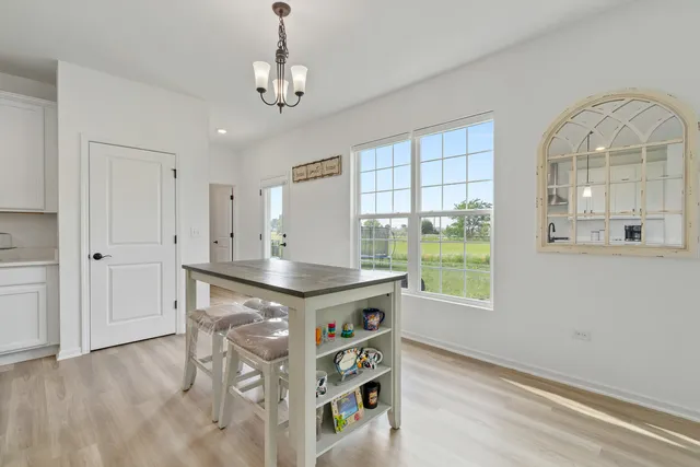 a view of a kitchen with a sink and a window